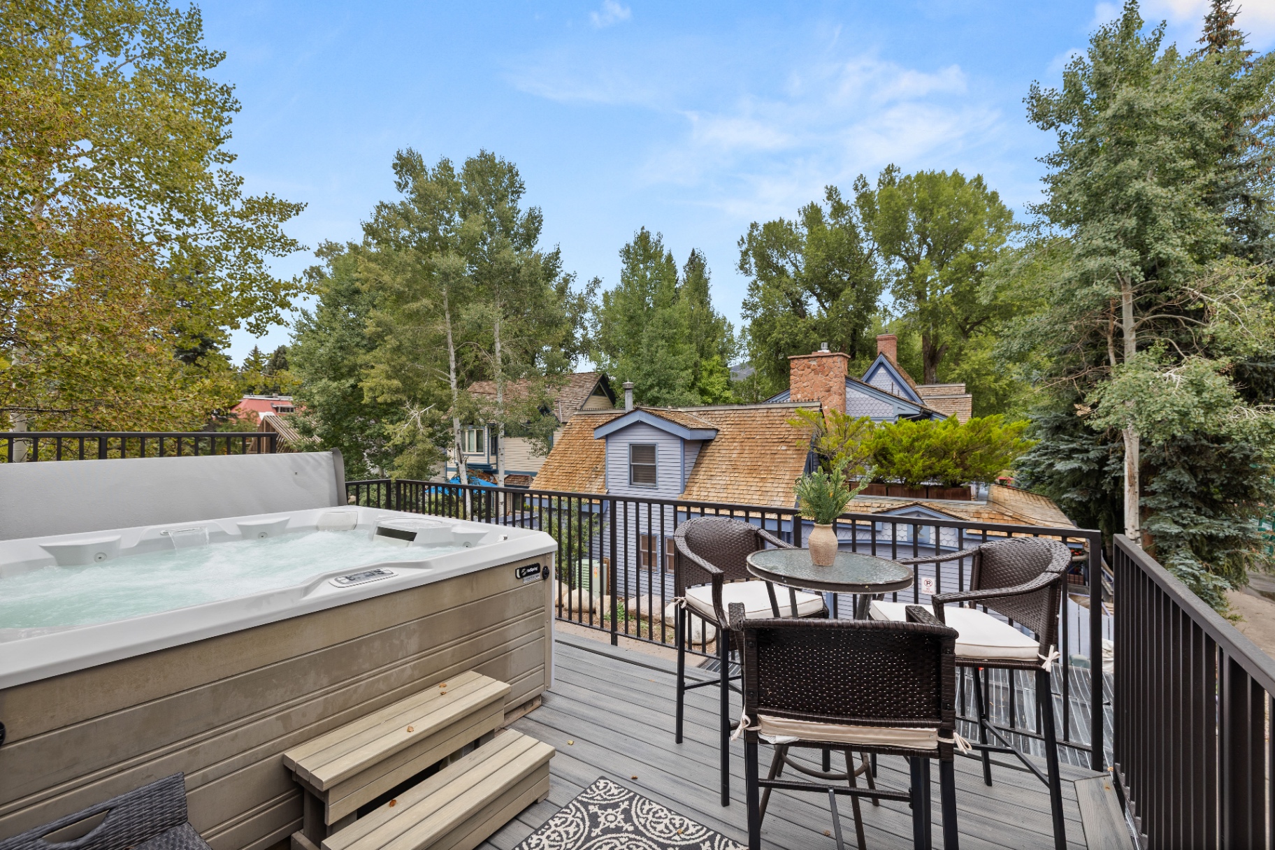 Private hot tub deck with seating area